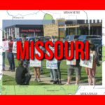 Protesters gather at intersection in Springfield Missouri holding signs against data centers