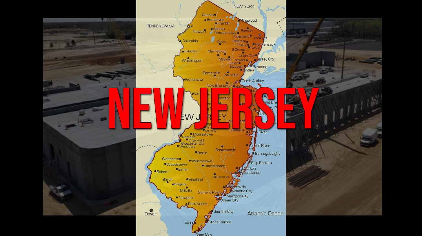 New Jersey residents hold protest signs against data center development at town hall meeting